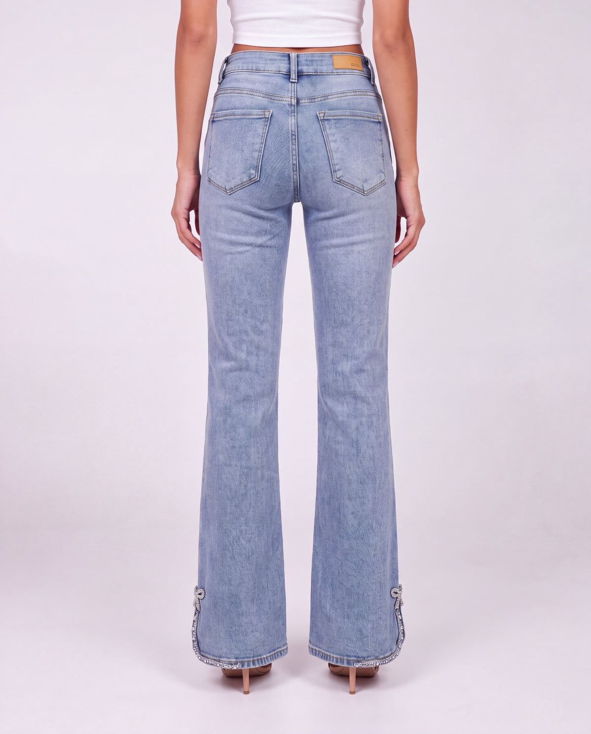 Bow Embellished Side Slit Flared Jeans